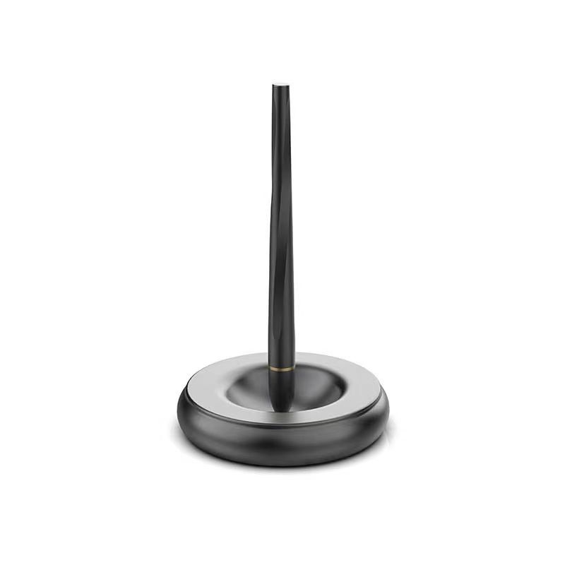 Magnetic levitating pen stand black metal base pen floating vertical white background