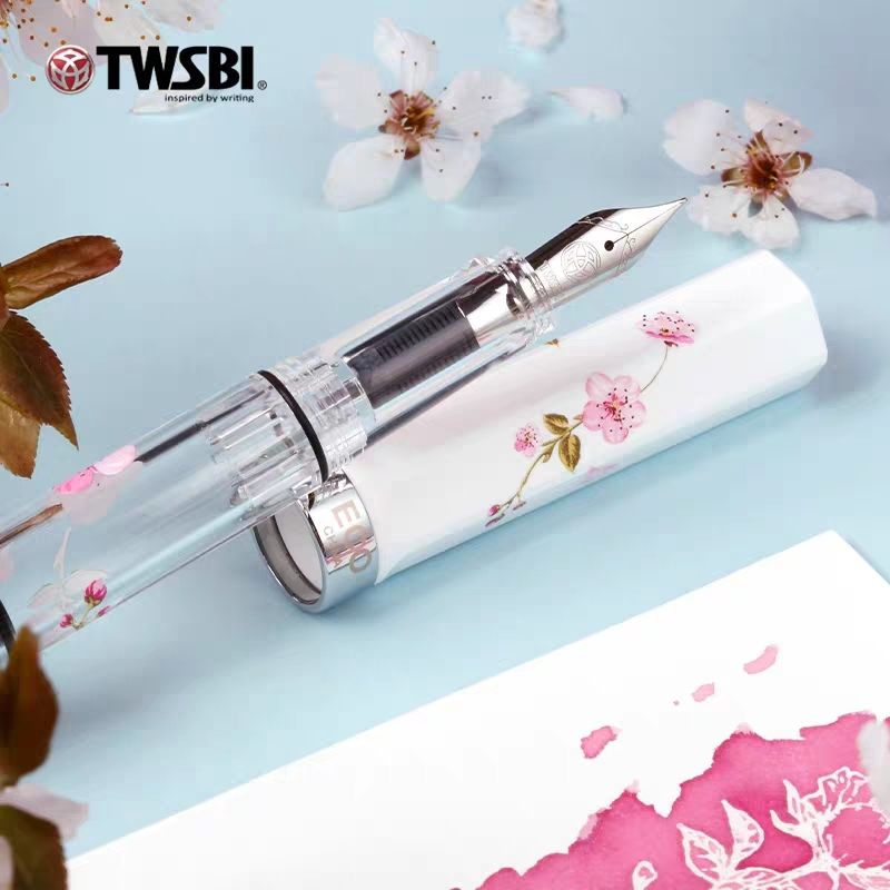 TWSBI ECO Sakura fountain pen with white cap and cherry blossom demonstrator barrel, capped and uncapped views